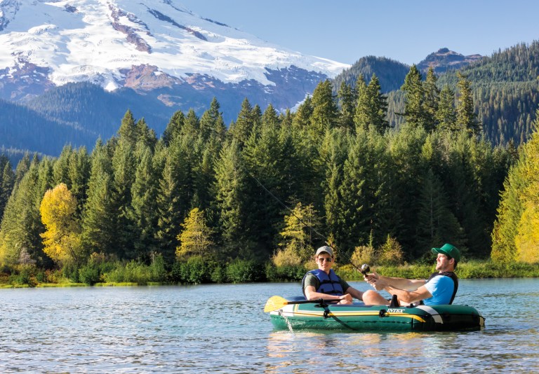 Two men fishing on mountain lake
