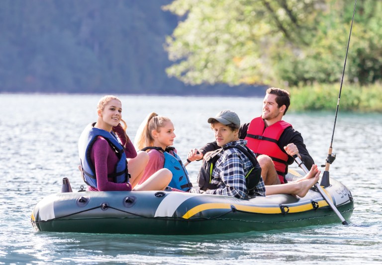 intex seahawk 4 boat set 68351 Friends fishing in inflatable boat on lake