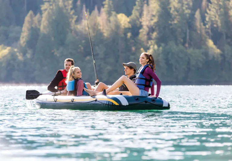 intex seahawk 4 boat set 68351 Friends fishing on inflatable raft in forest lake