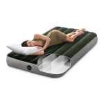 intex single (twin) classic airbed with built in pump 64761 Woman resting on green inflatable air mattress