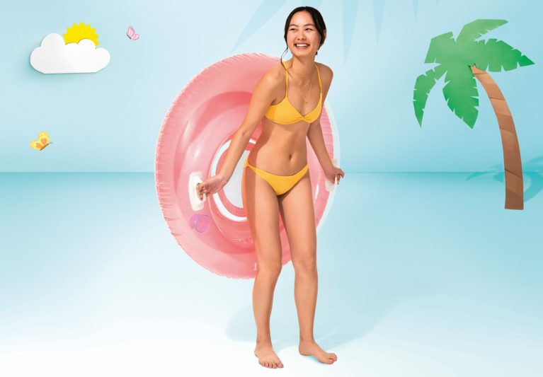intex sit'n lounge pool chair pink 58883 p Woman in yellow bikini with pink swim ring