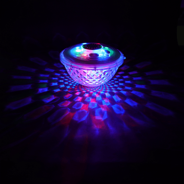 spire led light show waterproof light up pool fountain ct507 Colourful LED disco light projecting patterns in dark room