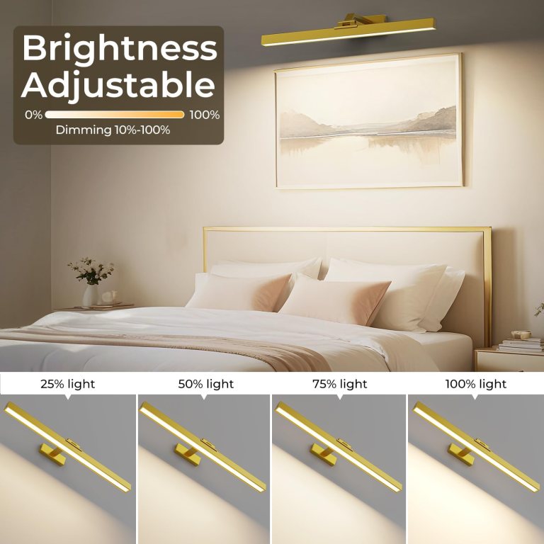 Adjustable brass picture light above bedroom bed