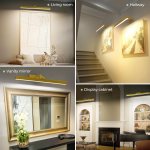 Gold picture lights illuminating artwork and interiors
