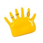 Yellow hand jewellery stand displaying rings