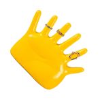 Yellow hand jewellery stand displaying decorative rings