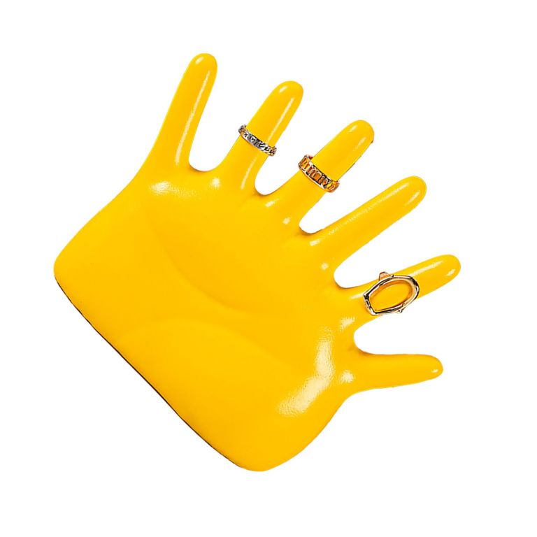 Yellow hand jewellery stand displaying decorative rings