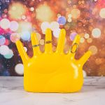 Yellow hand jewellery stand with rings