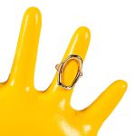 Yellow mannequin hand wearing statement gemstone ring