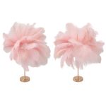 Two pink feather arrangements on gold stands