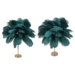 Two teal feather floor lamps with gold bases