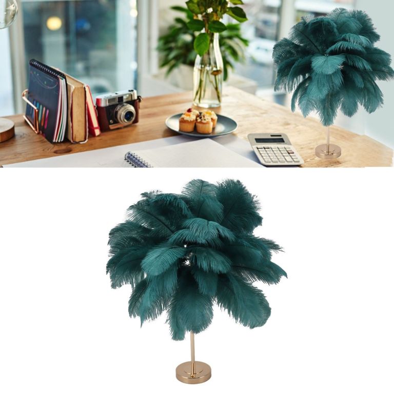 Teal feather table lamp on wooden desk