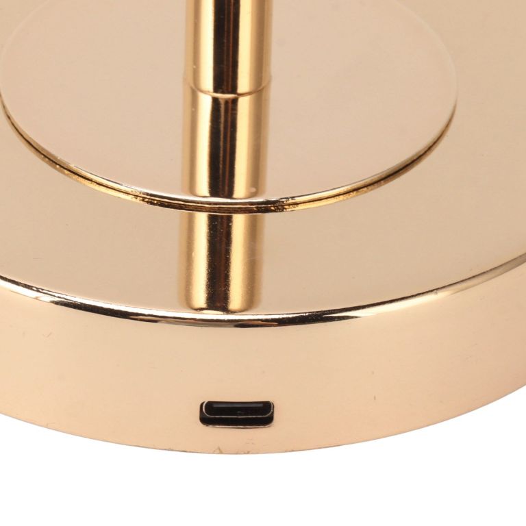 Close-up of gold lamp base with USB port