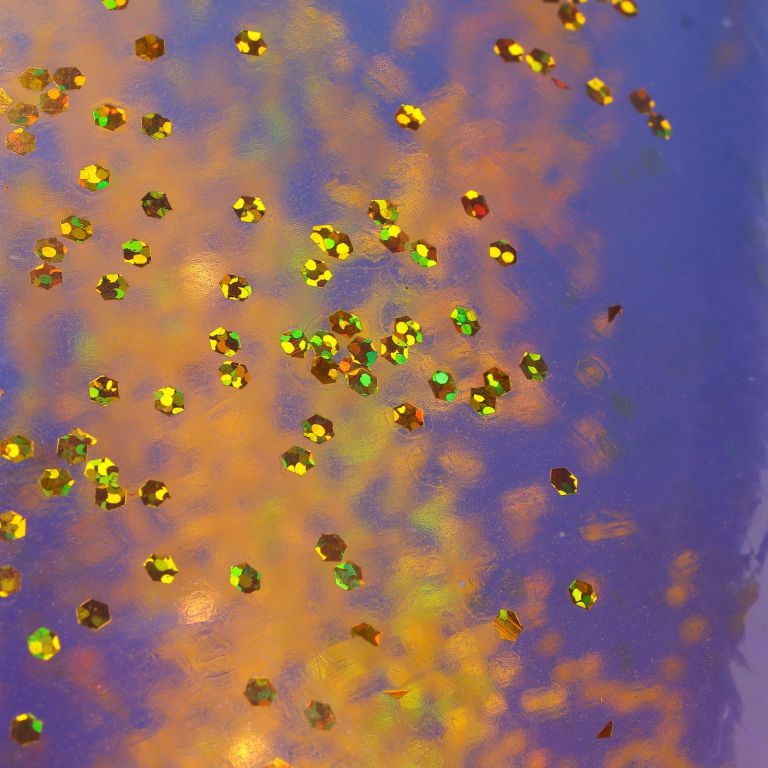 colored swimming rings bright colors sequin thickened inflatable glitter swim rings for swimming pool Gold glitter pieces on iridescent blue surface