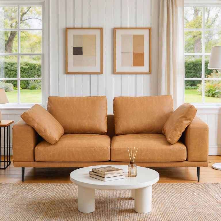 modern deep seated sofa, two seater, faux leather, brown brown pu leather Tan leather sofa in bright modern living room