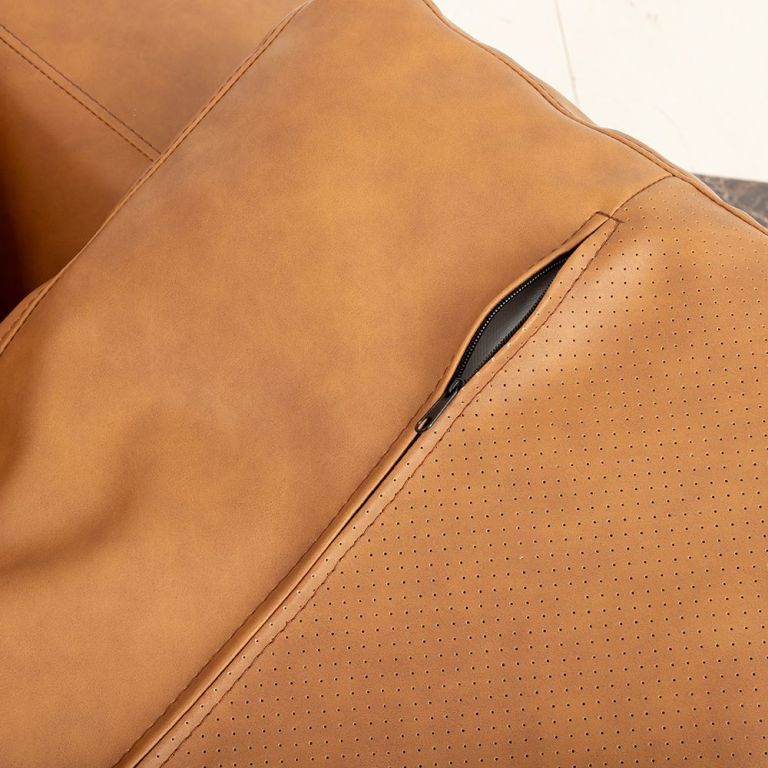 modern deep seated sofa, two seater, faux leather, brown brown pu leather Close-up of tan leather cushion with zipper