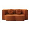 Rust curved sofa with round cushions