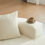 multifunctional round convertible sofa bed(compressed packaging) orange Ceramic coffee cup on cream sofa arm