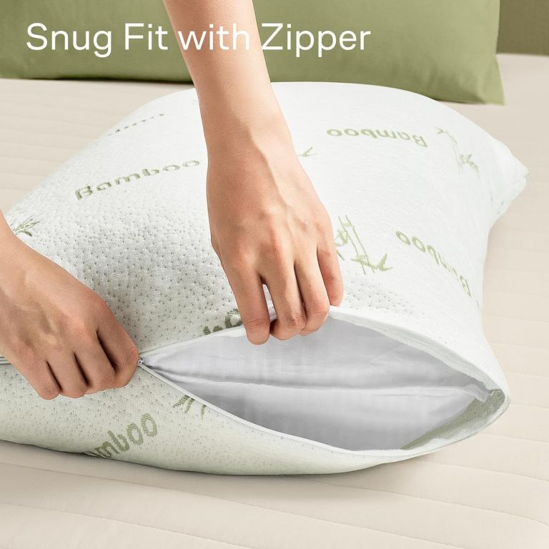 Hands unzipping bamboo pillow cover on cushion