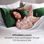 Woman relaxing on bed with green satin pillows