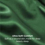 Close-up of green silky fabric with text overlay