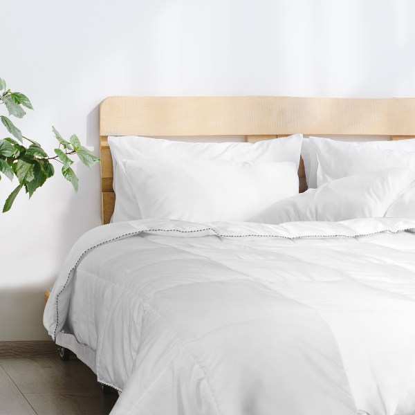 royal comfort bamboo blend quilt 250gsm luxury duvet 100% cotton cover double white White bed with wooden headboard and plant