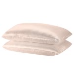 Two beige satin pillowcases stacked together