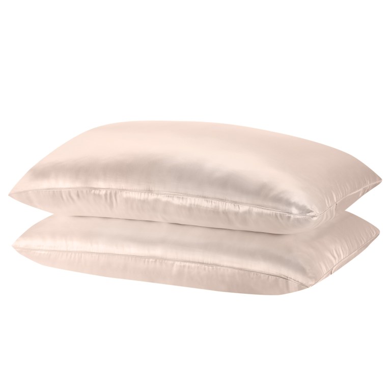 Two beige satin pillowcases stacked together