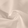 Soft beige silk fabric folded in gentle curves