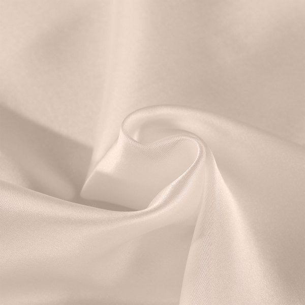 Soft beige silk fabric folded in gentle curves