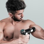 Man using massage gun on bicep