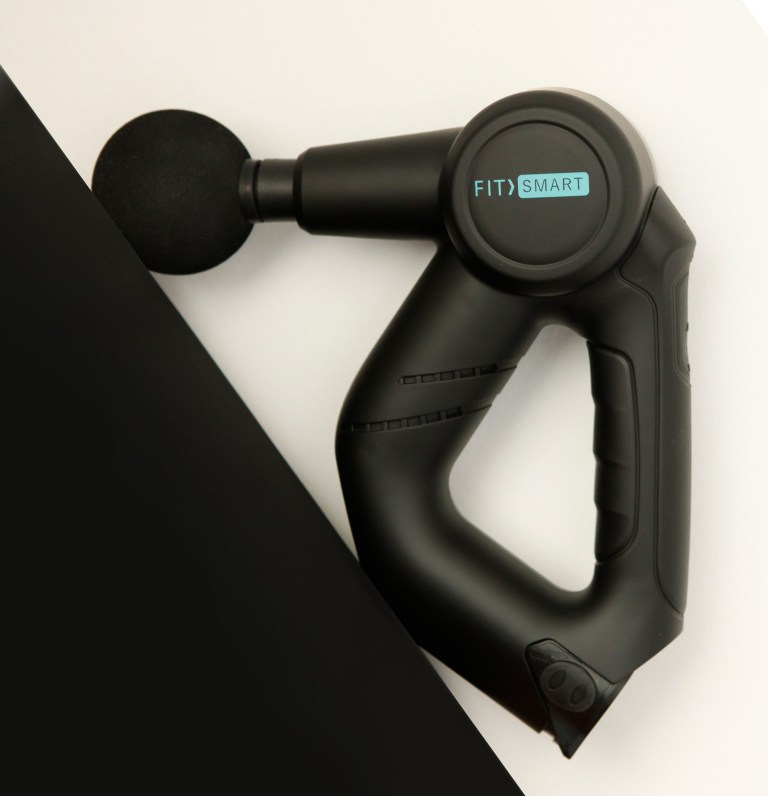 Black handheld massage gun with round foam head