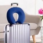 Blue travel neck pillow on silver suitcase