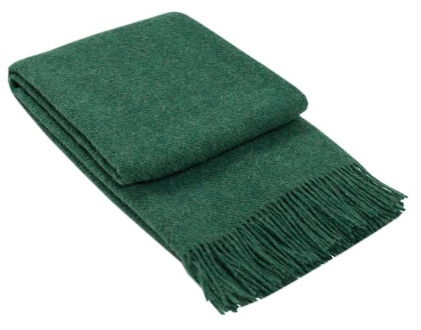 Folded green fringed throw blanket