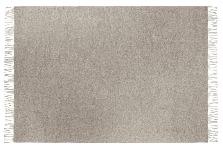 Neutral beige woven rug with fringe edges