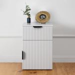 White fluted cabinet with vase and gold frame