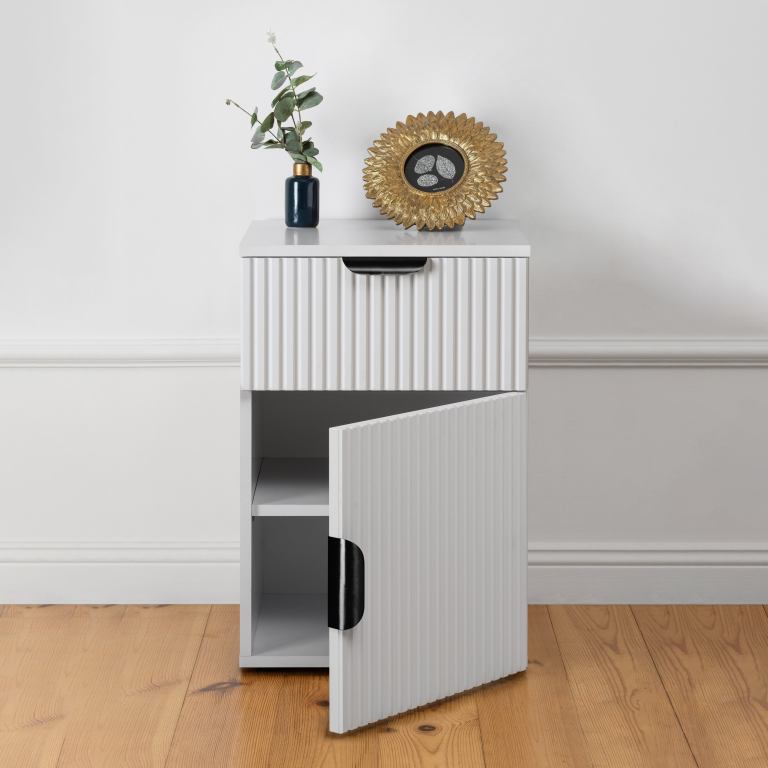 White fluted cabinet with vase and gold frame