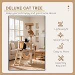 Two cats playing on deluxe cat tree indoors