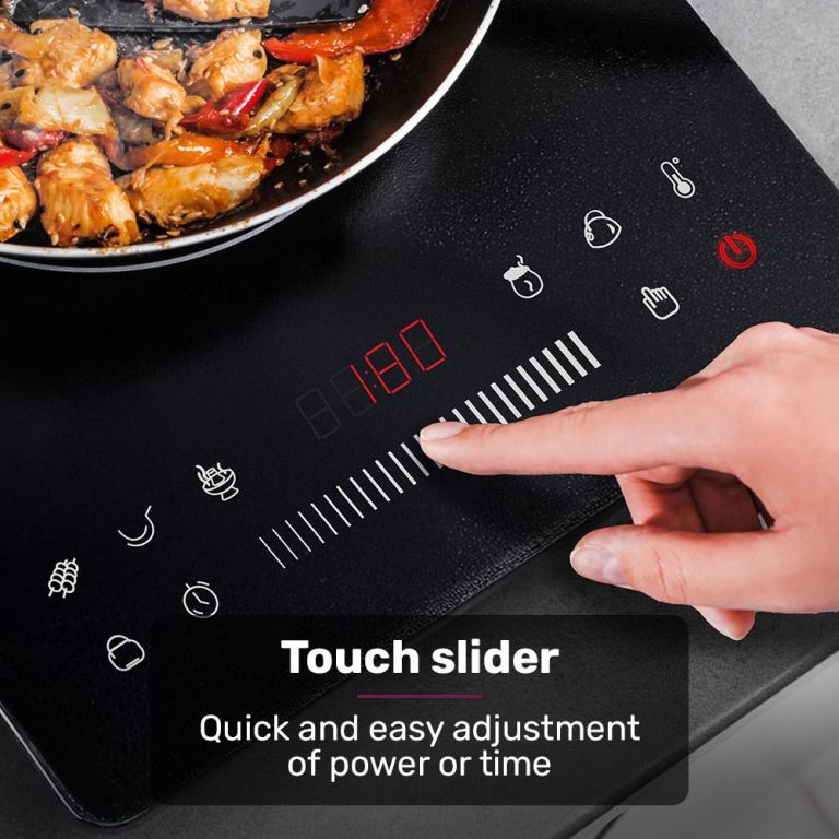 eurochef induction benchtop cooktop, 2000w, 9 heat levels, fast electric portable cooker, touch controls with slider Hand adjusting touch slider on induction cooktop