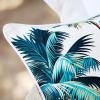 Tropical palm leaf print cushion close-up
