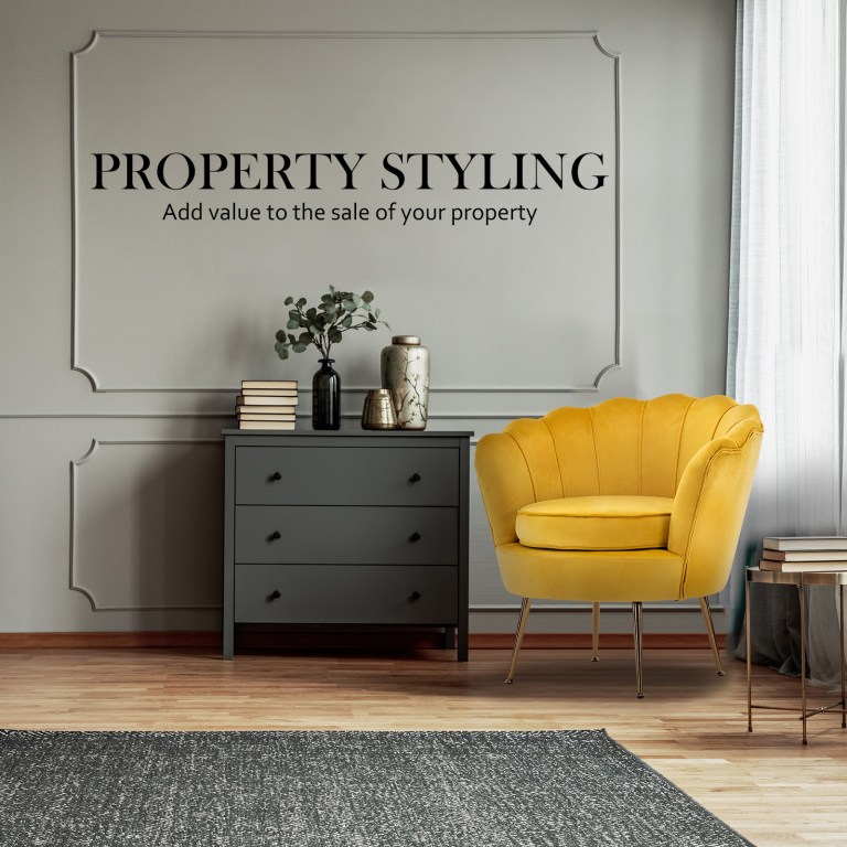 Property styling interior with yellow armchair and dresser
