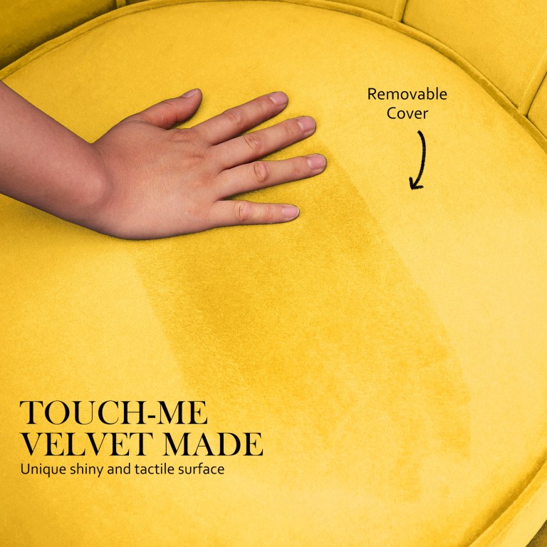 Hand touching yellow velvet chair cushion
