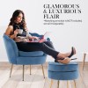ottoman foot stool velvet fabric metal leg round navy blue Woman relaxing on blue velvet armchair with laptop