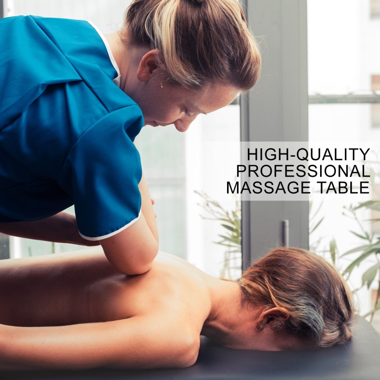 Massage therapist treating client on professional table