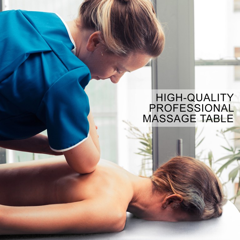 Massage therapist treating client on professional table