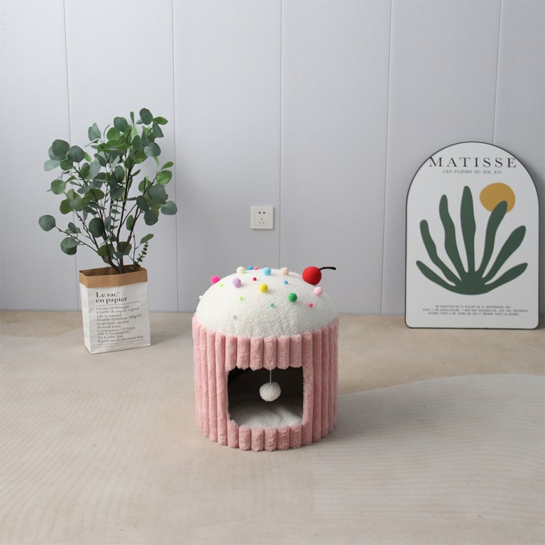 Cupcake-shaped cat bed in minimalist room