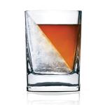 Whisky in tumbler with large triangular ice