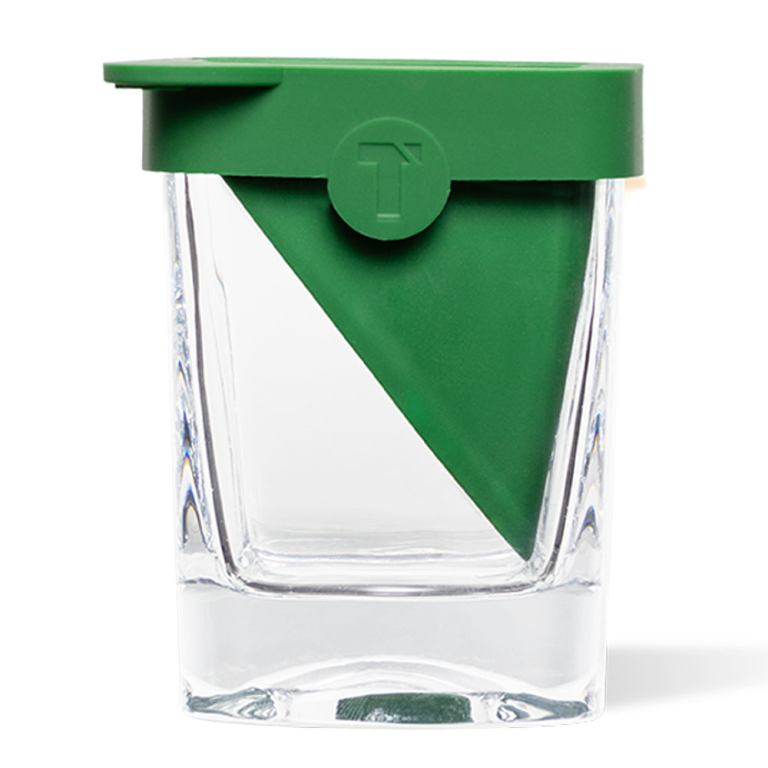 Glass container with green triangular lid insert