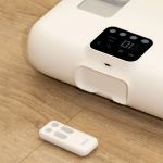 Adjustable bed base with remote on floor