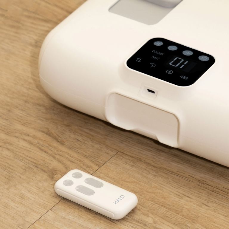 Adjustable bed base with remote on floor